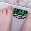 Bathroom scales calling for Help+ logo removed from scales